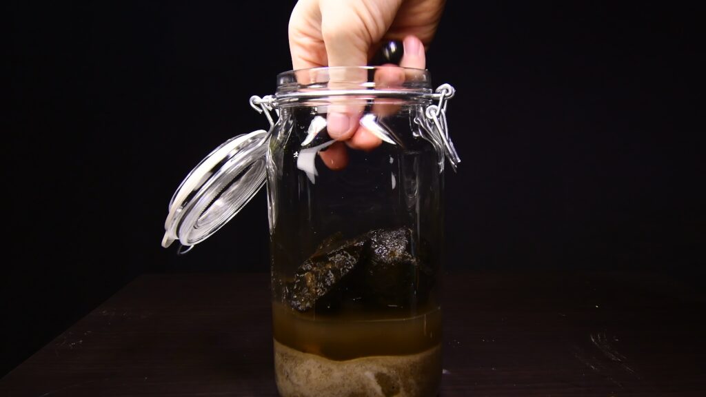 Arranging stones as hardscape inside the ecosphere jar