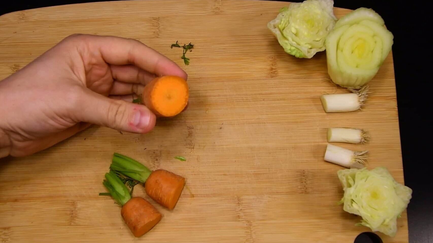 Fresh vegetable scraps prepared on a board for regrowing