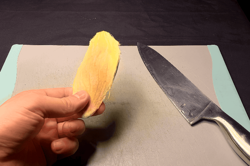Cleaned mango kernel after removing the fruit