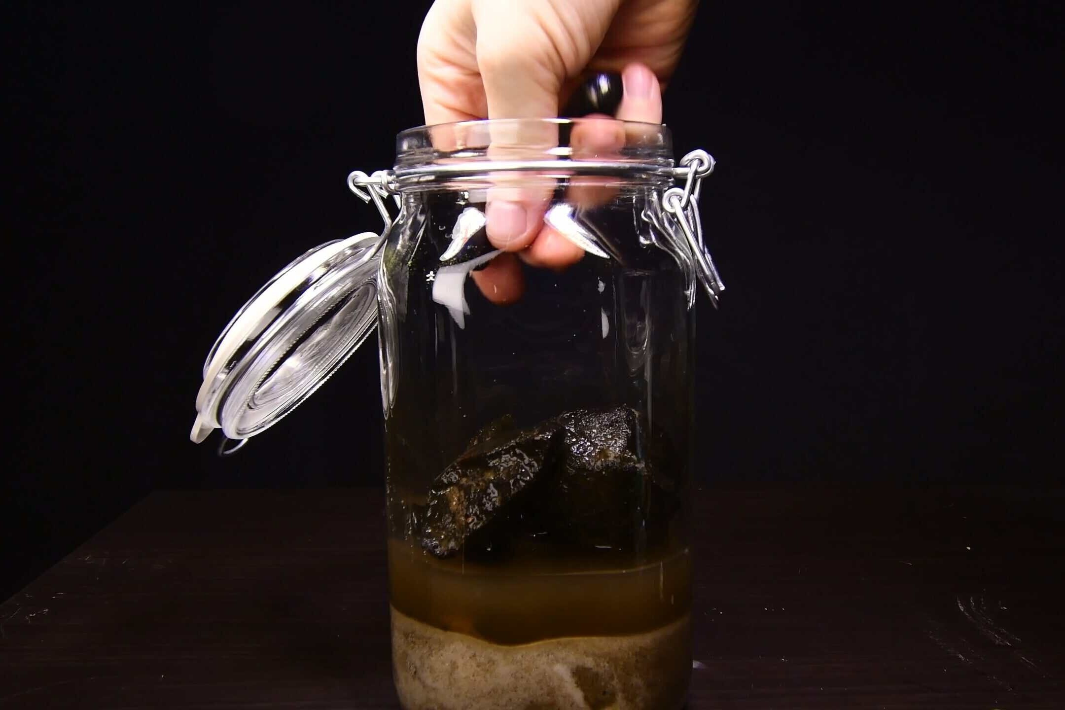 Arranging stones as hardscape inside the ecosphere jar